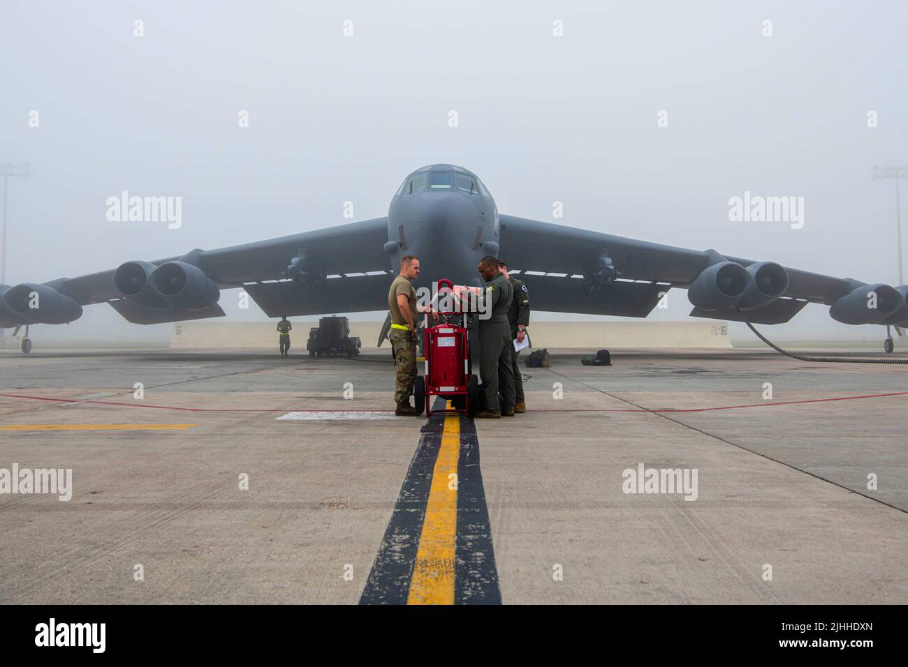 A B52H Stratofortress sits on a flight line preparing for flight at Minot Air Force Base, North Dakota, July 15, 2022. The B52H stands 45 feet tall, has a wingspan of 187 feet and the wings can flex up to 5 feet up up and down. (U.S. Air Force photo by Airman 1st class Alexander Nottingham) Stock Photo