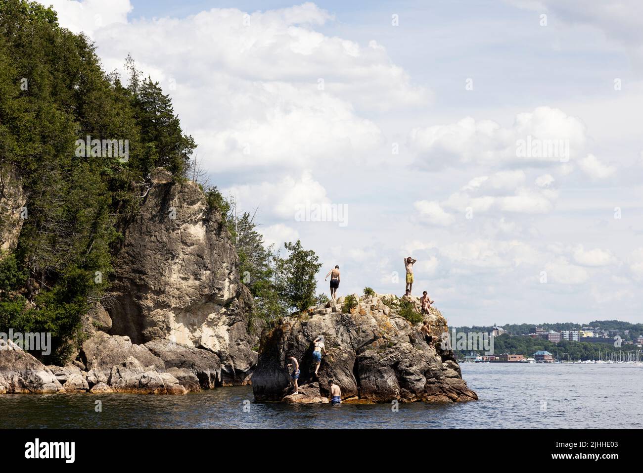Swimmers and divers on a summer day at Lone Rock Point on Lake Champlain in Burlington, Vermont, USA. Stock Photo