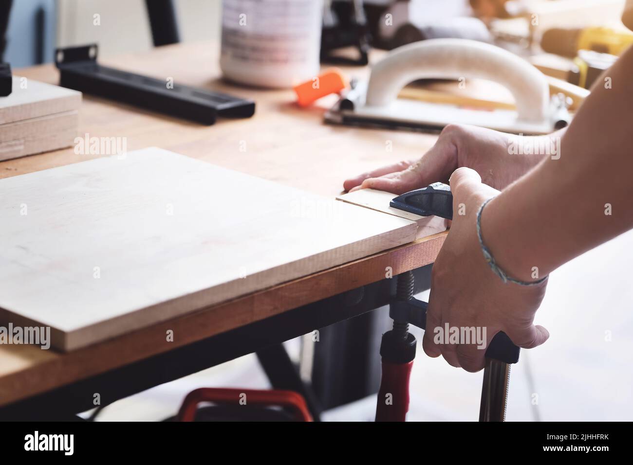 Woodworking operators are decorating pieces of wood to assemble and