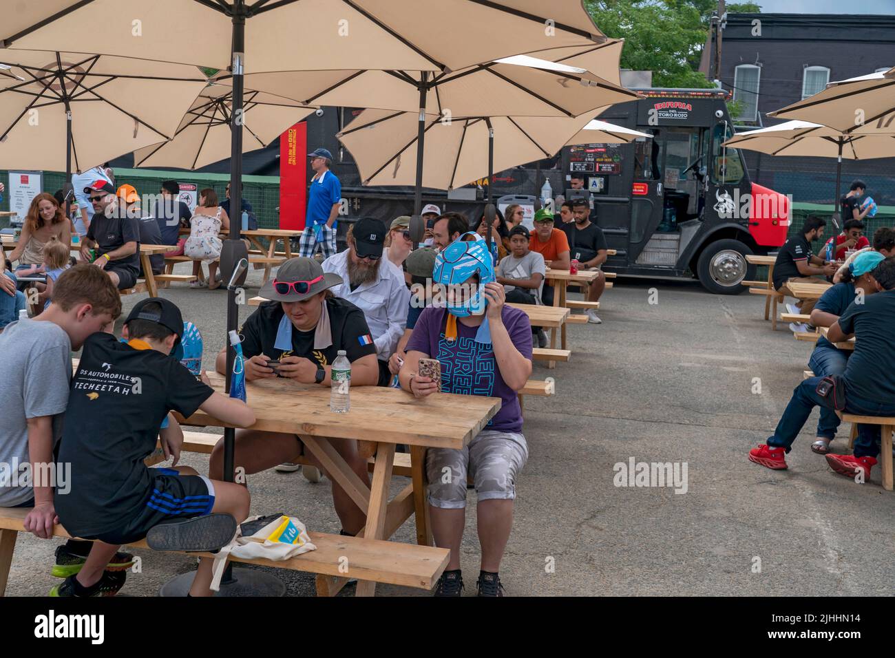 NEW YORK, NY - JULY 17: Spectators sitting in the shade enjoy food and drink during the ABB FIA Formula E Championship, New York City E-Prix Season 8 Round 12, on July 17, 2022 in the Brooklyn borough of New York City. Stock Photo