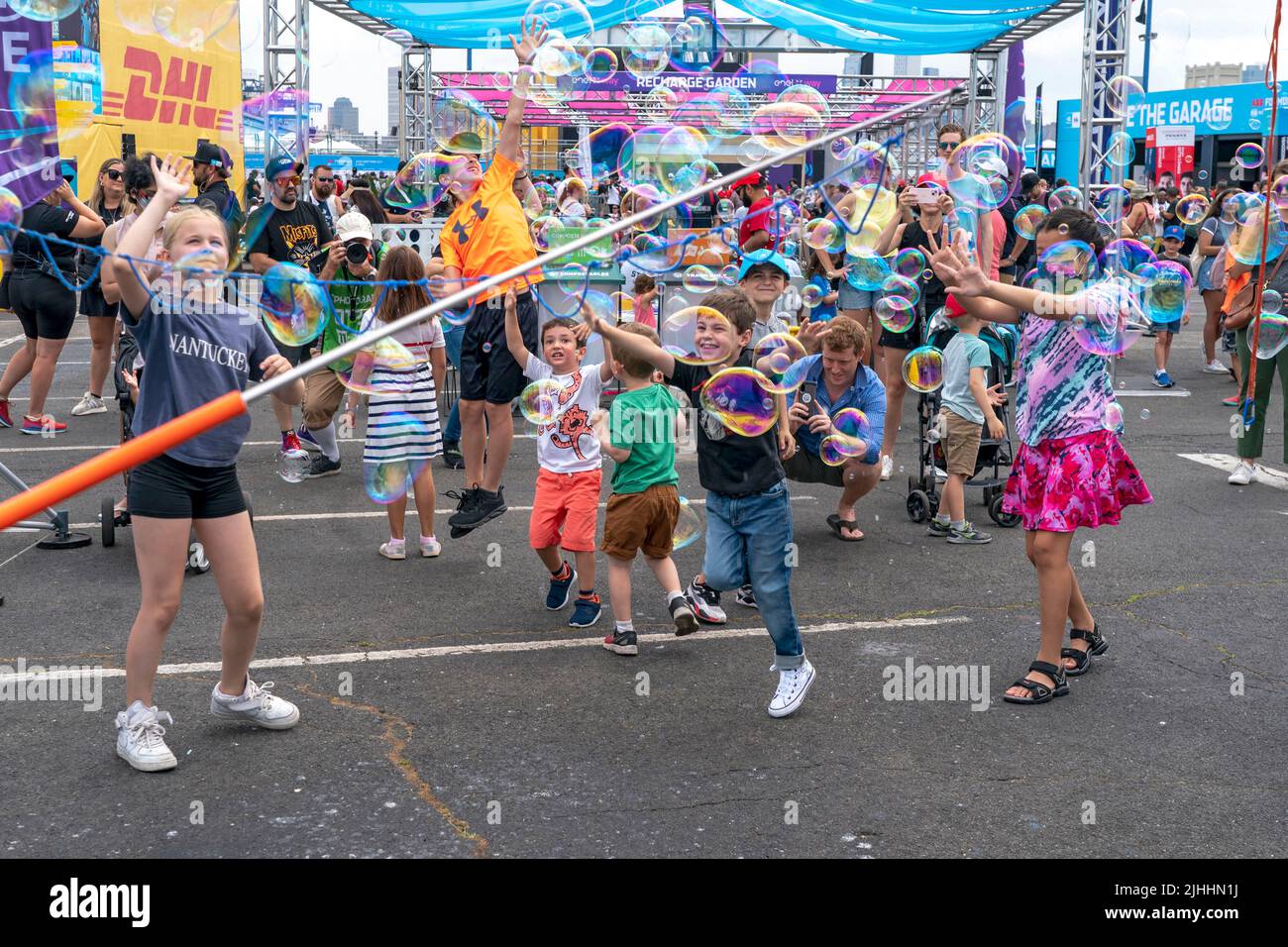 NEW YORK, NY - JULY 17: Kids play with Soap bubble during the ABB FIA Formula E Championship, New York City E-Prix Season 8 Round 12, on July 17, 2022 in the Brooklyn borough of New York City. Stock Photo