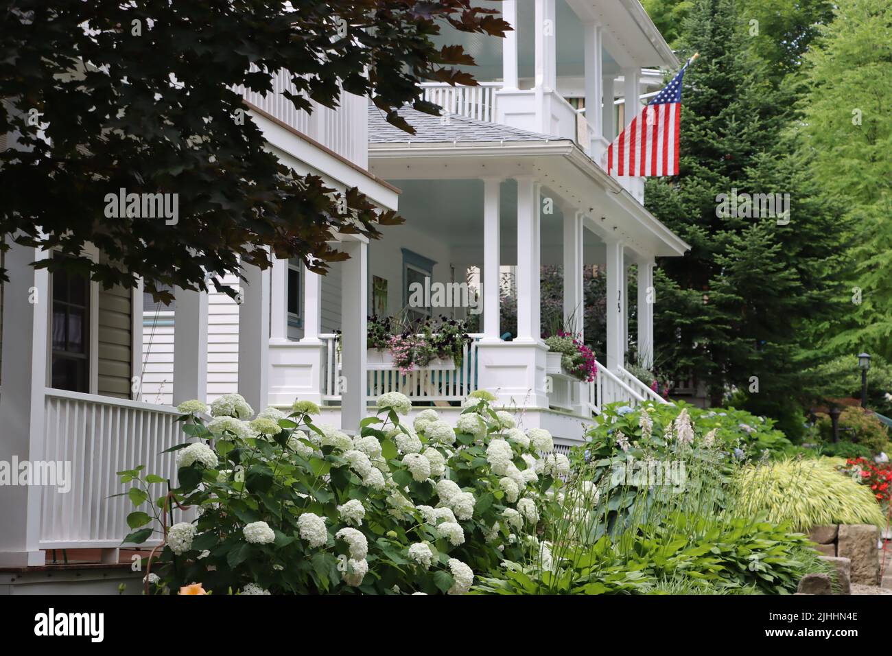 One of hundreds of beautiful houses with garden at Chautauqua Institution, Chautauqua,  NY, June 2022 Stock Photo