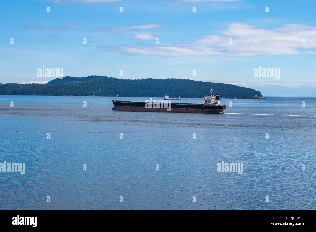Bulk carrier passing through Swanson Channel Stock Photo