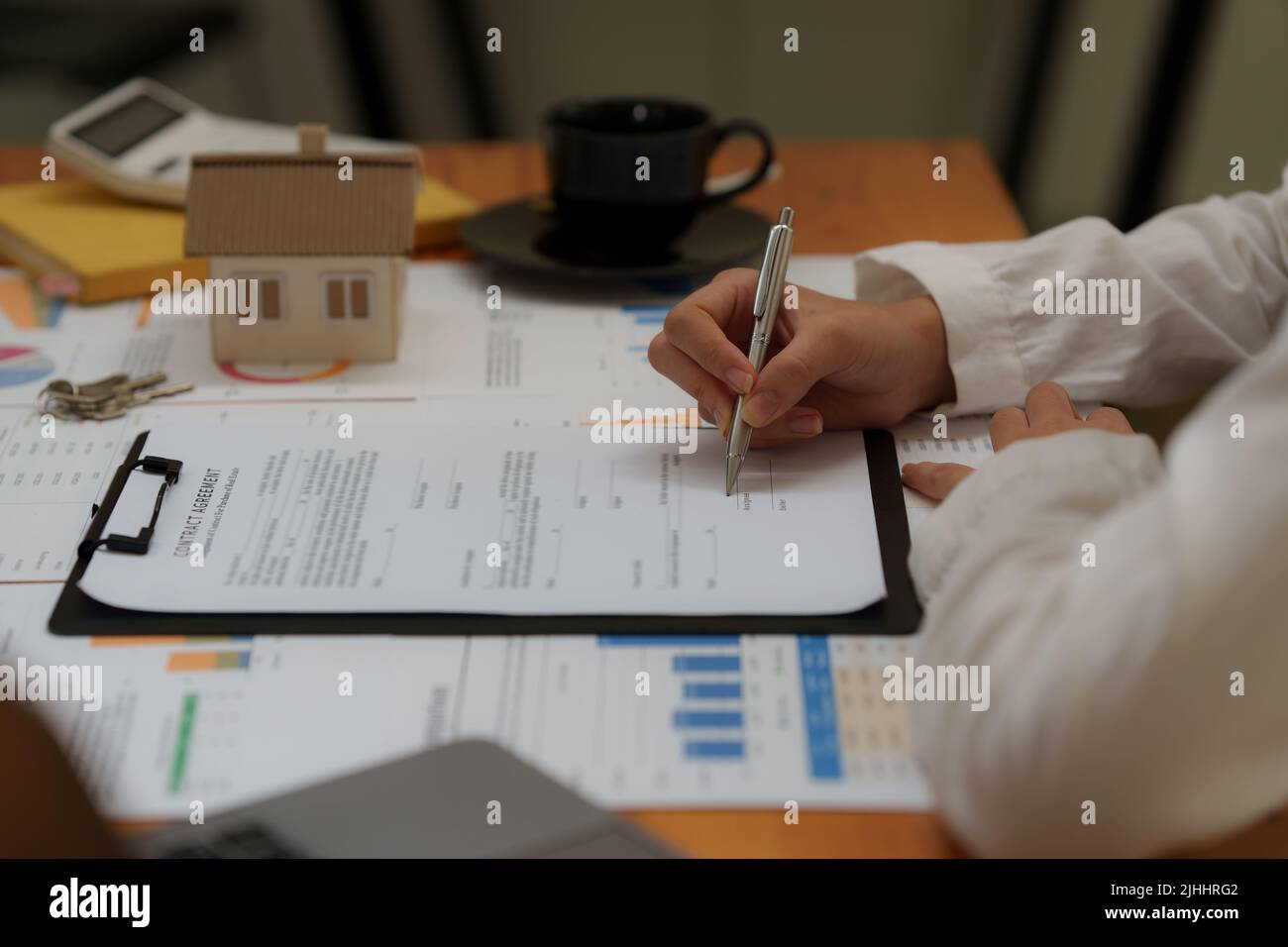 Business woman waiting signing agreement contract for buying house or