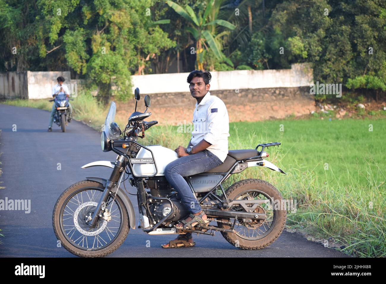 Handsome bearded guy posing on his motorcycle looking to the side Stock  Photo - Alamy