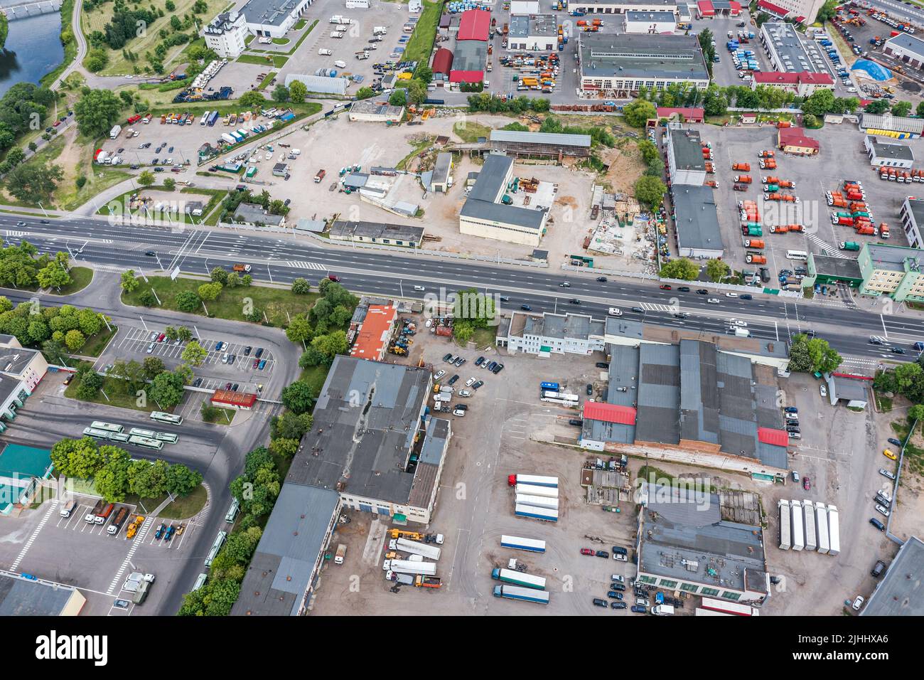 industrial area with many industrial buildings and warehouses. aerial view from flying drone. Stock Photo