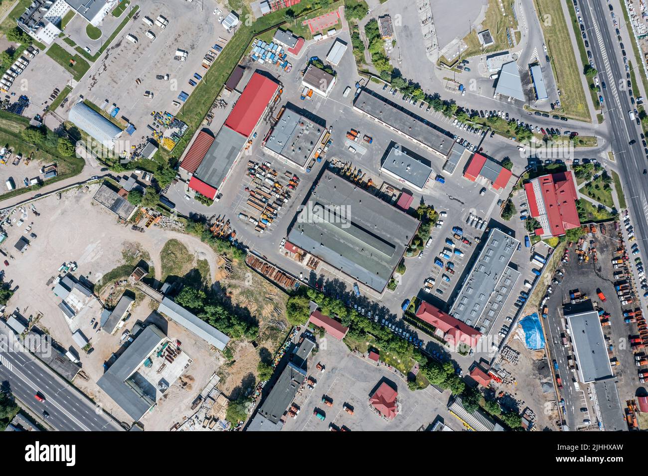 aerial top view of industrial warehouses or factory buildings in suburban city area Stock Photo