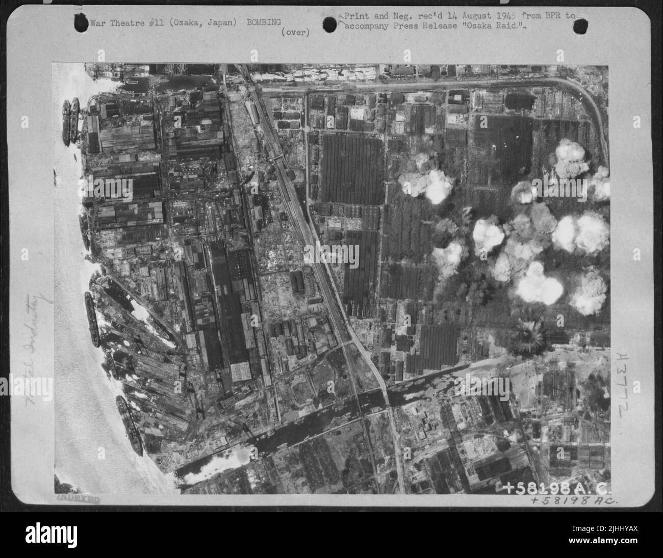 The Sumitomo Light Metale Industry Plant At Osaka Is Seen At The Height Of A B-29 Attack Of 24 July 1945 Which Destroyed 95%% Of The Buildings. One B-29 Was Lost And 40 Damaged As A Result Of Heavy And Intense Flak. The Terrific Blast Effect Of The Two-T Stock Photo