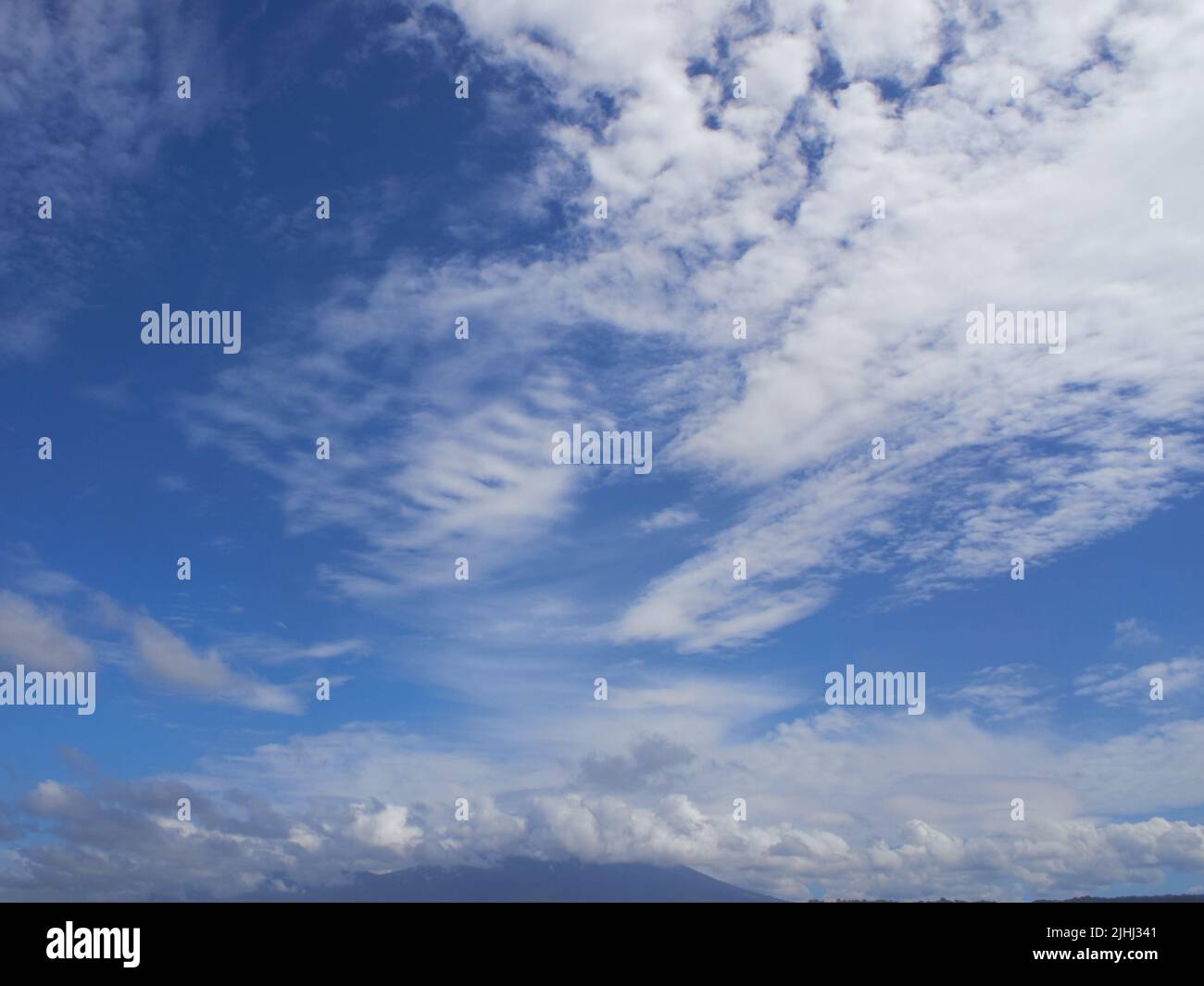 blue sky with dramatic white clouds Stock Photo