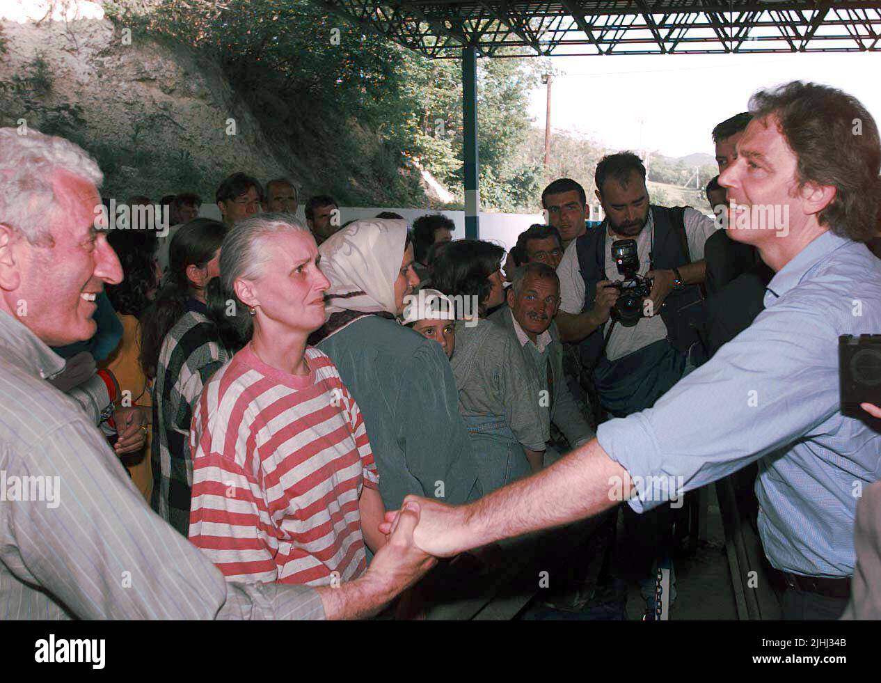 File photo dated 03/05/99 of the then Prime Minister Tony Blair meeting Kosovan refugees at the border crossing point between Kosovo and Macedonia, near Skopje. New Labour's attempts to tackle immigration were partly thwarted by a UN protocol which meant the UK was fundamentally deemed an 'attractive destination' for asylum seekers, internal memos suggest. Home Office permanent secretary Sir David Omand said the 1951 Refugee Convention - which says refugees should not be sent back to a country where they face serious threats to their safety - and the 'generous reception' given to people from t Stock Photo