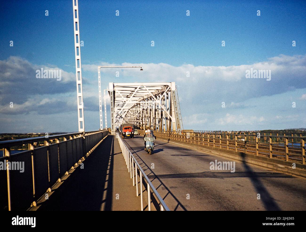 Road and railway lines, Little Belt Bridge, Old Lillebælt Bridge truss bridge completed 1935, Den gamle Lillebæltsbro, Middelfart, Denmark 1958 Stock Photo