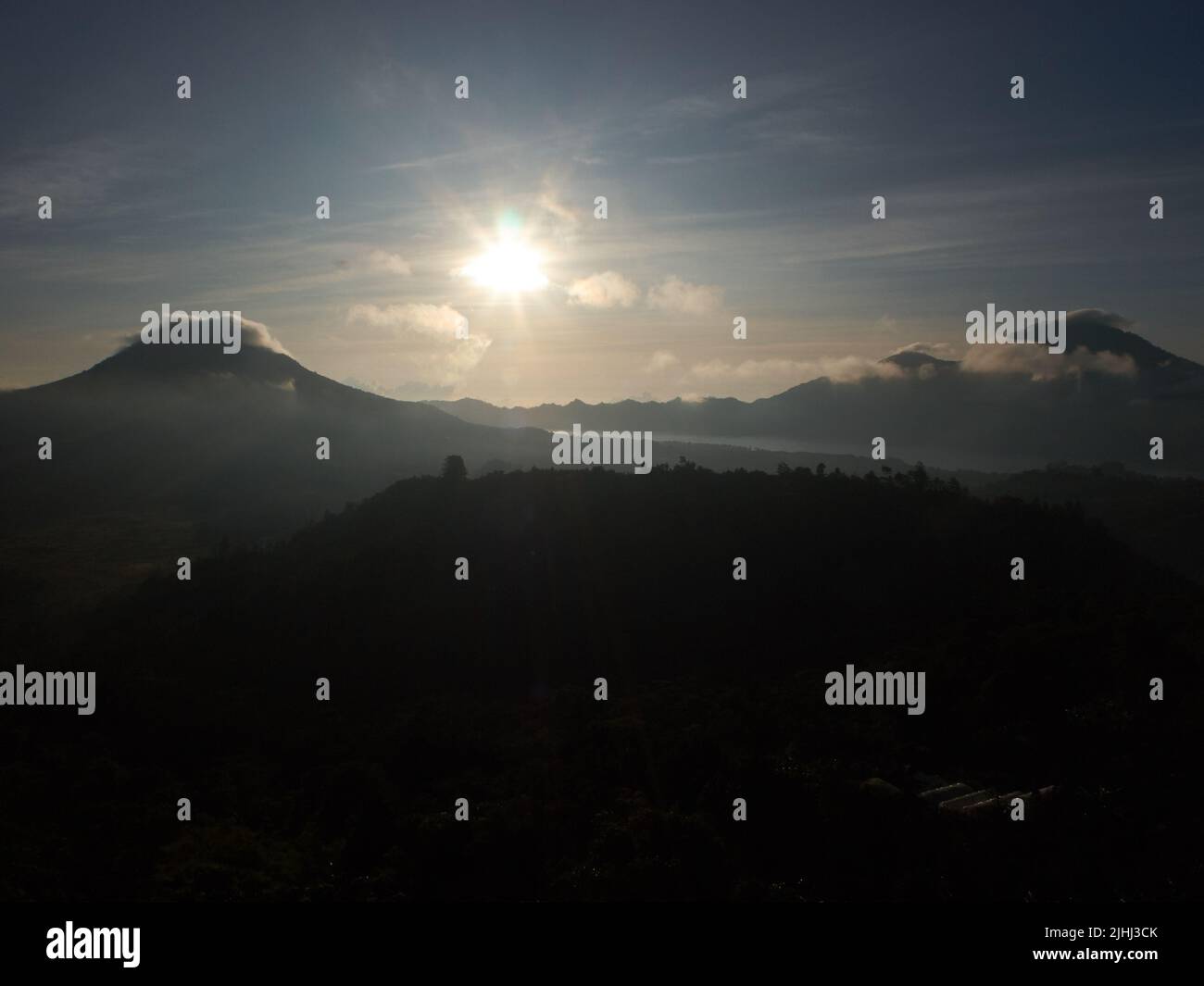 dramatic sunrise between two hills Stock Photo Alamy