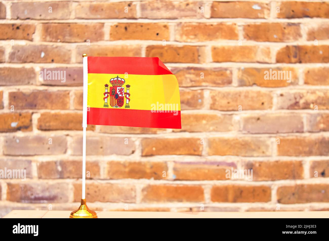 close up of National Spanish flag yellow and red colors,hand holding