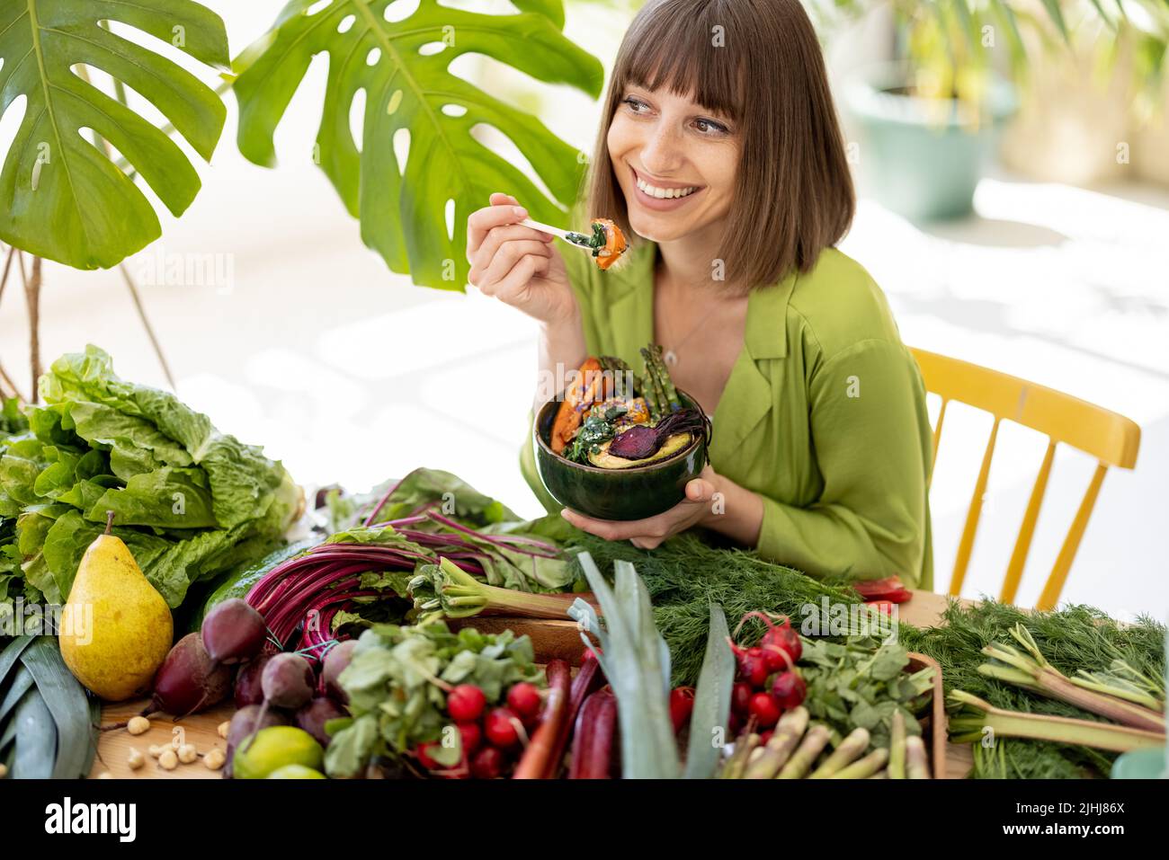 Woman with fresh healthy food indoors Stock Photo