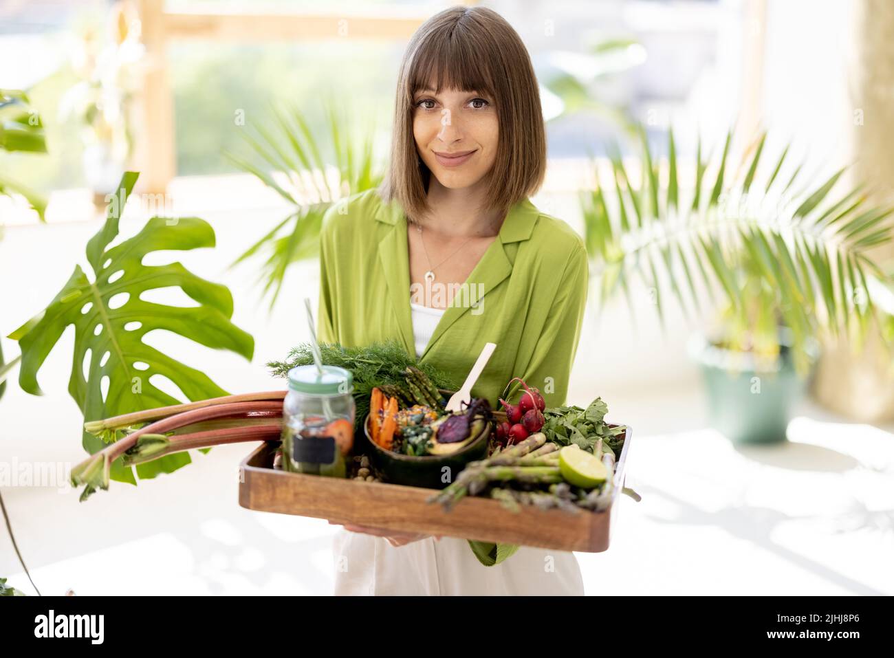 Woman with healthy food indoors Stock Photo