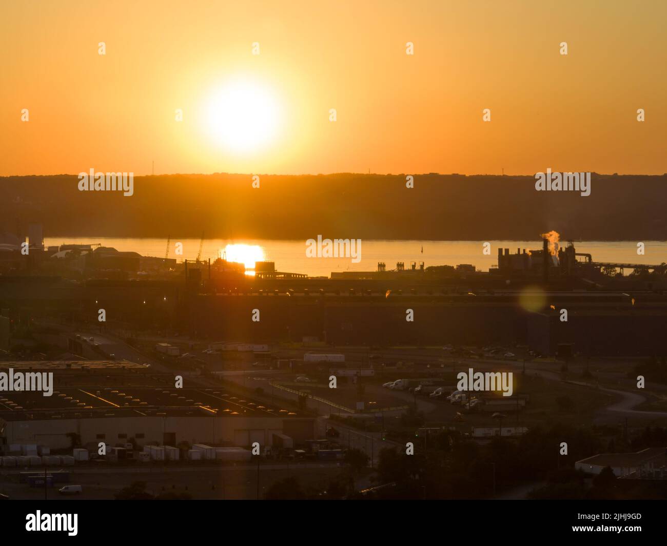 An aerial view looking towards sunset on a large industrial manufacturing area. Stock Photo