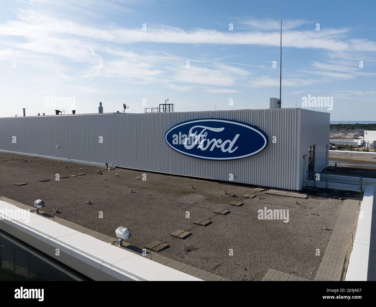 The Ford Motor Company logo is seen atop of their Canada headquarters office building at near their Oakville Assembly plant. Stock Photo