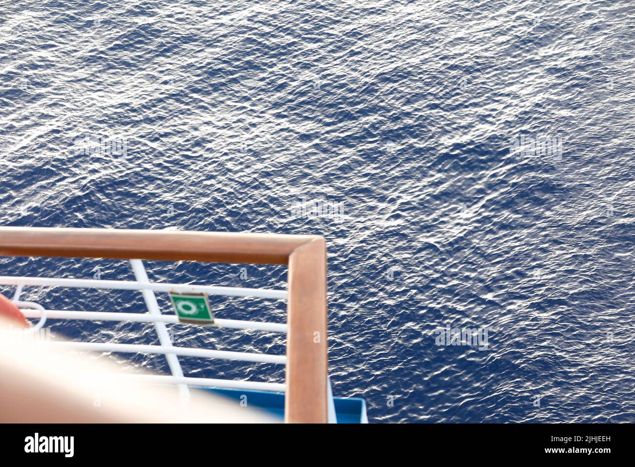 Railing of cruise ship with ocean view Stock Photo - Alamy