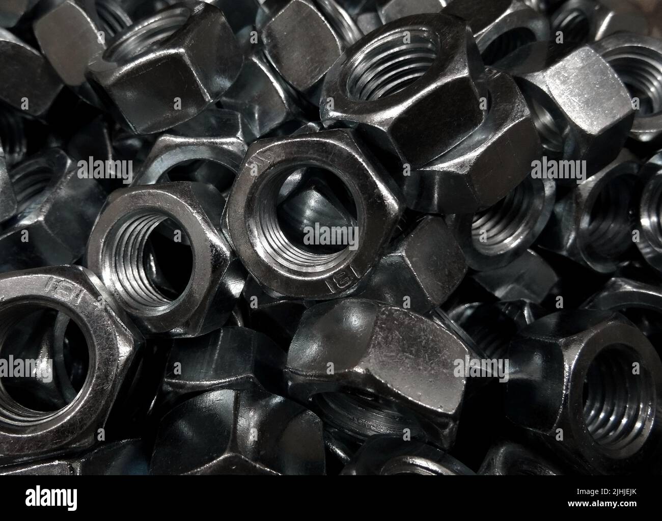 Metal hex screw nuts close up texture background Stock Photo Alamy