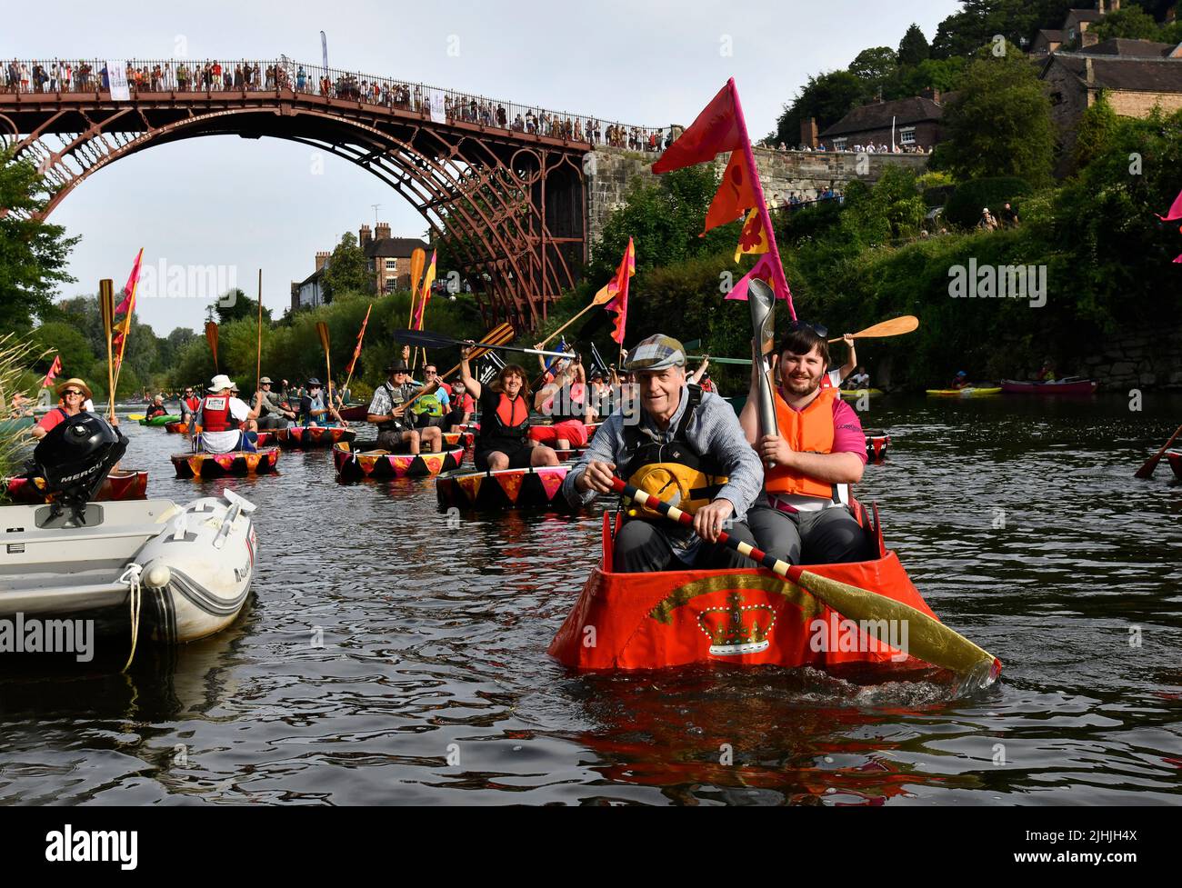 Ironbridge, Shropshire, Uk. July 19th 2022. Queen's Baton Relay. The Commonwealth Games Queen's Baton Relay passing through Ironbridge in Shropshire. The baton travelled by coracle on the River Severn escorted by a flotilla of coracles from the Ironbridge Coracle Society. Credit: Dave Bagnall /Alamy Live News Stock Photo