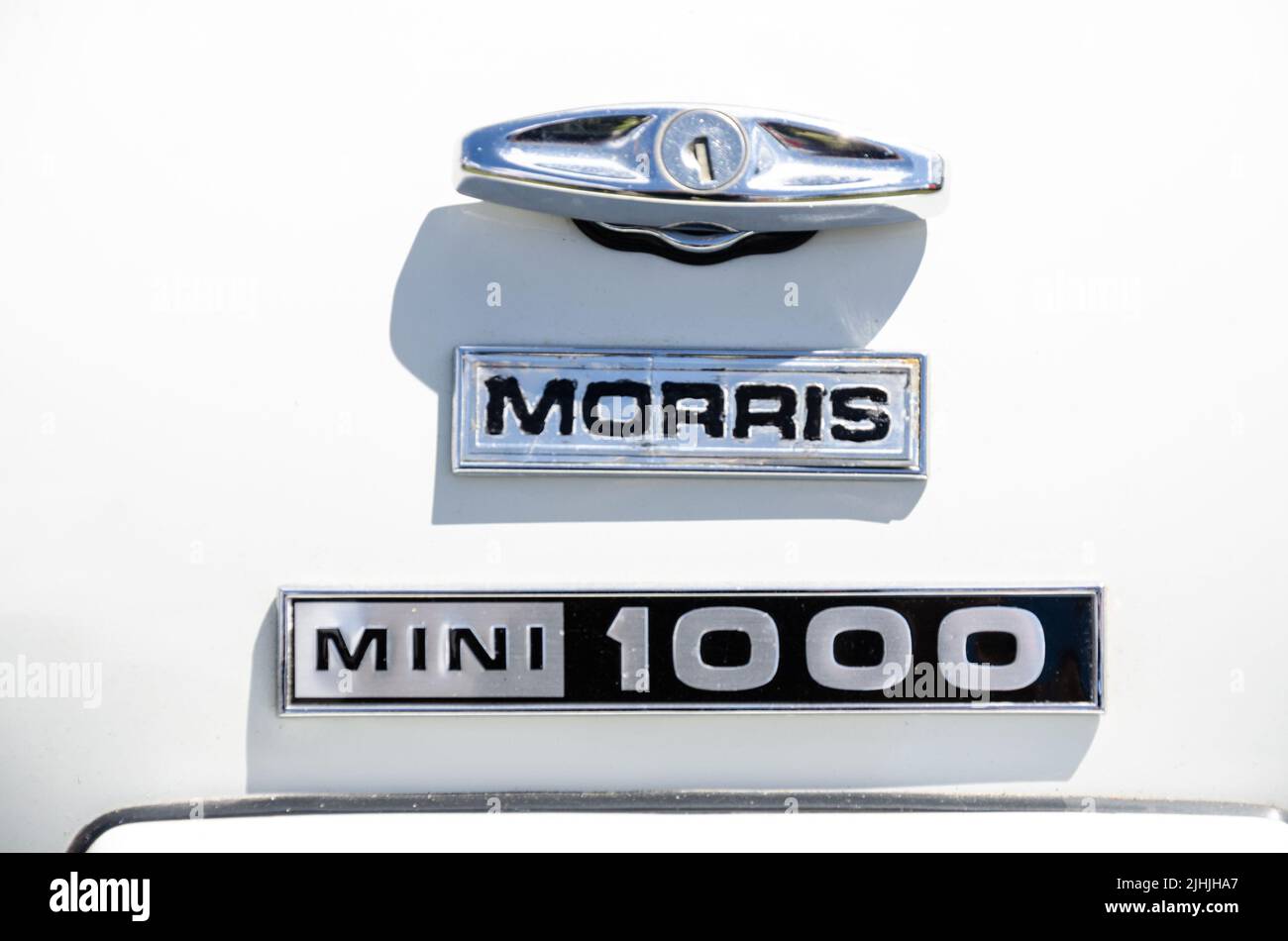 Close up view of the make and model badges of a white 1970 Austin Mini 1000. Stock Photo