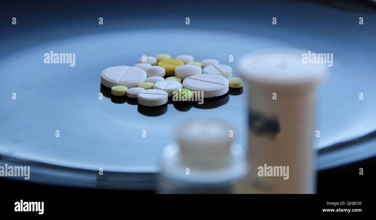 Medicinal pills and tablet containers with soft focus studio isolated Stock Photo