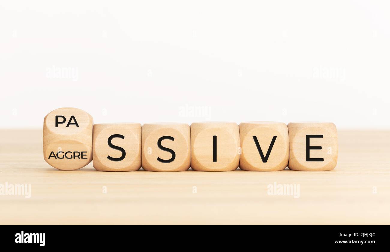 Passive Aggressive concept. Turning wooden block with word. Copy space Stock Photo