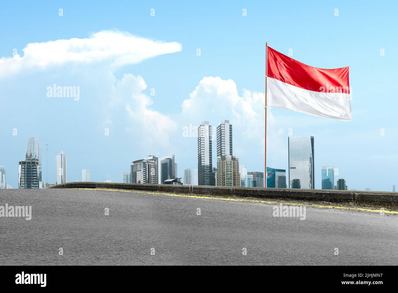 Indonesian flag on the pole waving with blue sky background Stock Photo ...