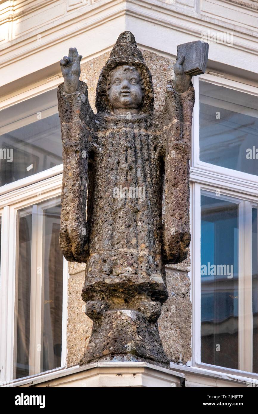 Sculpture of the Münchner Kindl on the facade of the Munich Courtyard, Salzburg, Austria, Stock Photo
