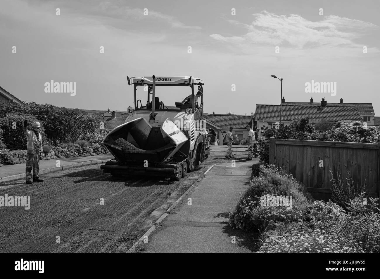 Cormac groundworks relaying tarmac road Stock Photo Alamy