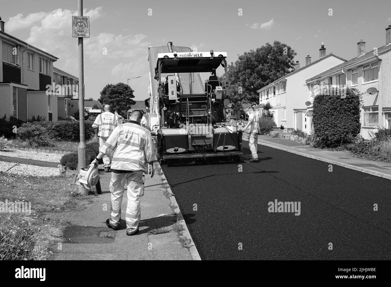 Cormac groundworks relaying tarmac road Stock Photo Alamy
