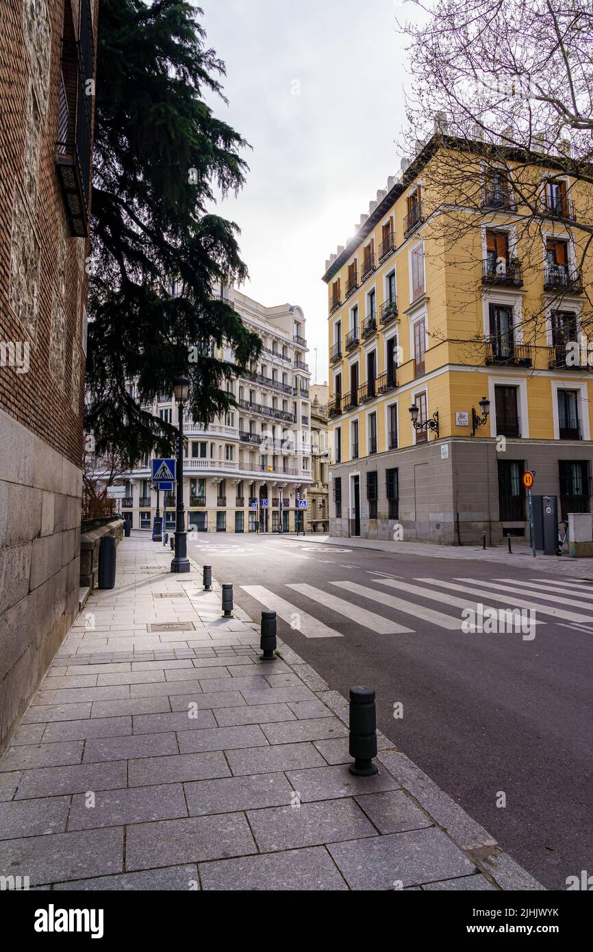 Madrid street with neoclassical buildings of different colors and typical balconies. Spain. Stock Photo