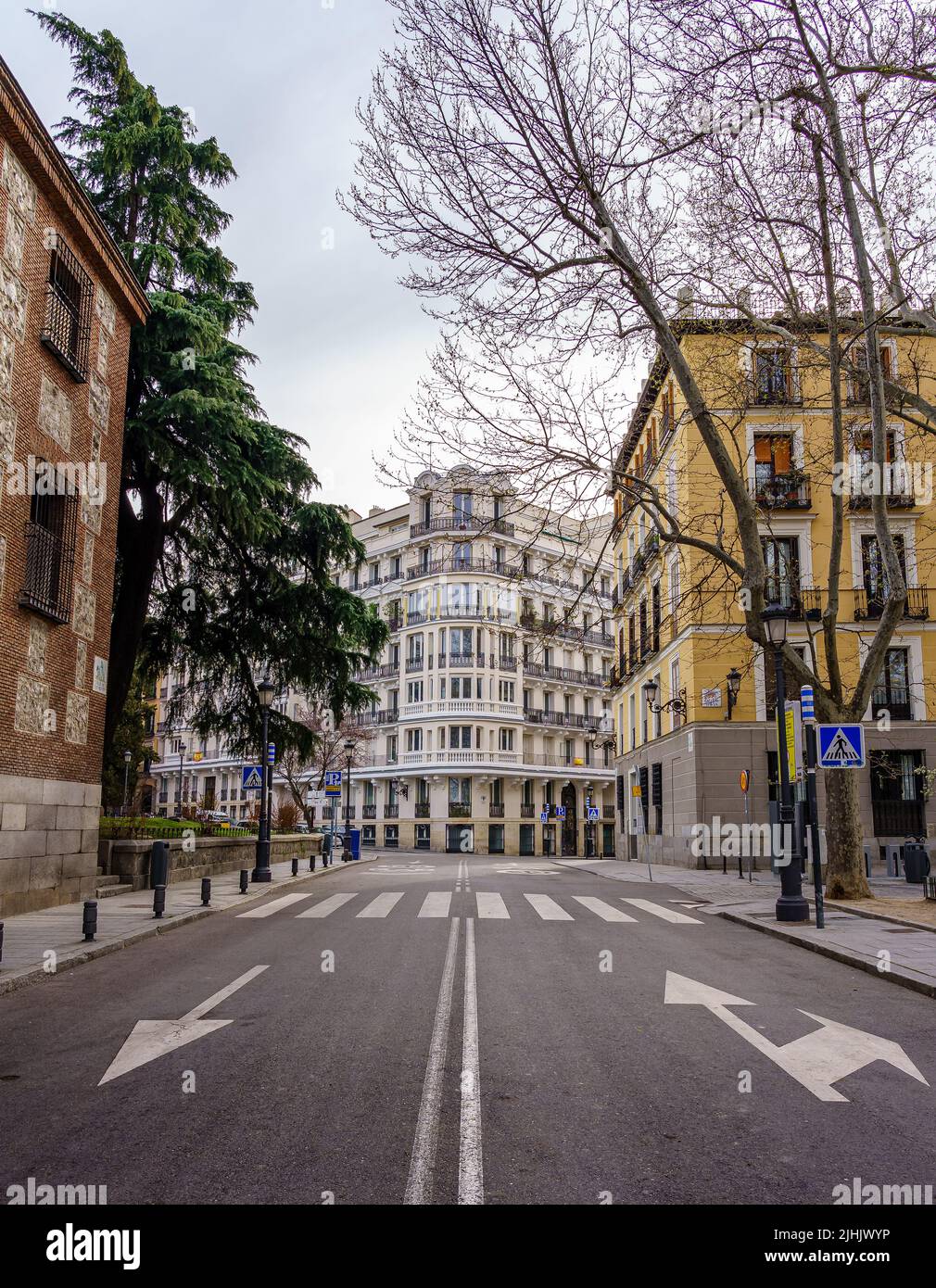 Madrid street with neoclassical buildings of different colors and typical balconies. Spain. Stock Photo