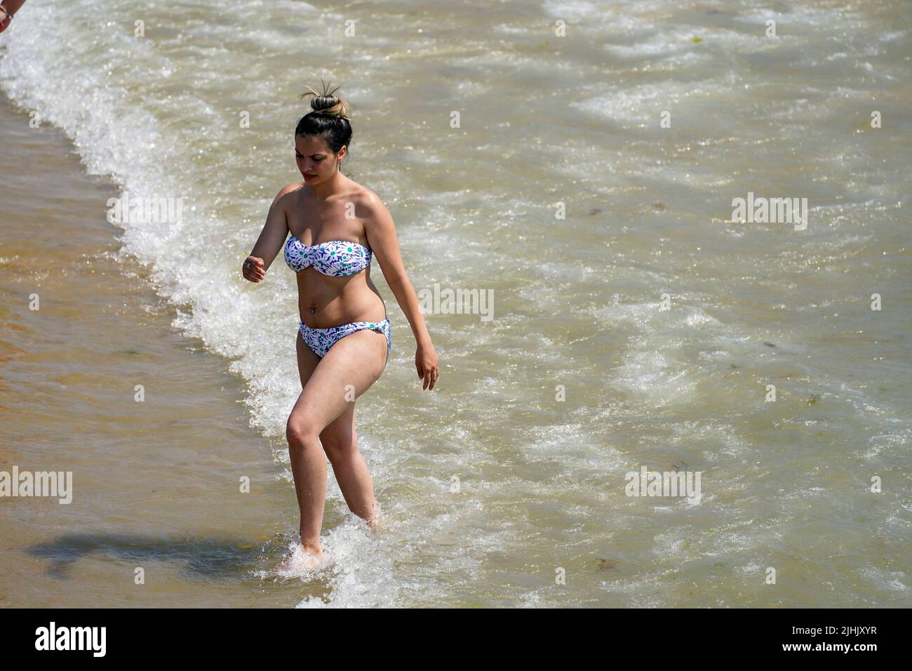 A lady cools off in the sea in Bournemouth. Britons are set to melt on the hottest UK day on record as temperatures are predicted to hit 40C. Picture date: Tuesday July 19, 2022. Stock Photo