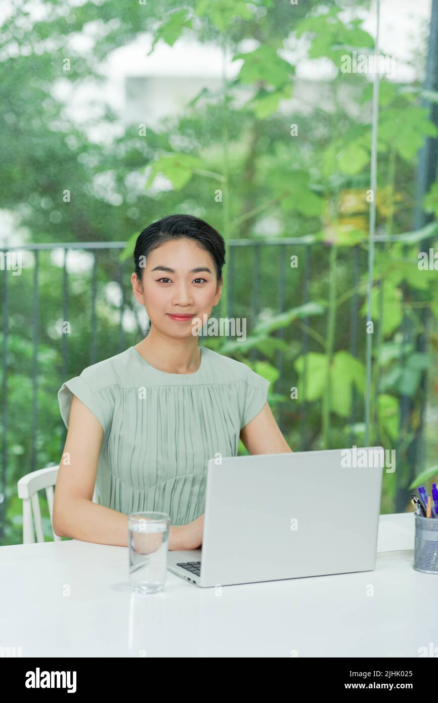 bright picture of happy woman with laptop computer Stock Photo