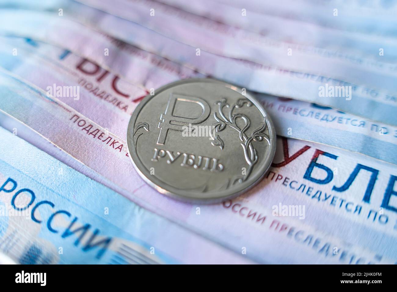 Economic crisis, decline of world economy. Ruble devaluation. fall of Russian currency. Currency exchange. ruble symbol on the coin Stock Photo