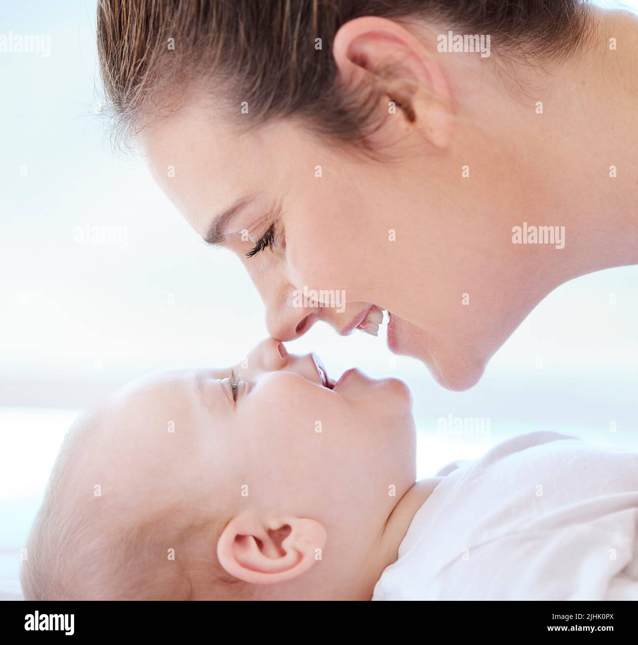 That smell of a baby. a young mother bonding with her adorable baby boy at home. Stock Photo
