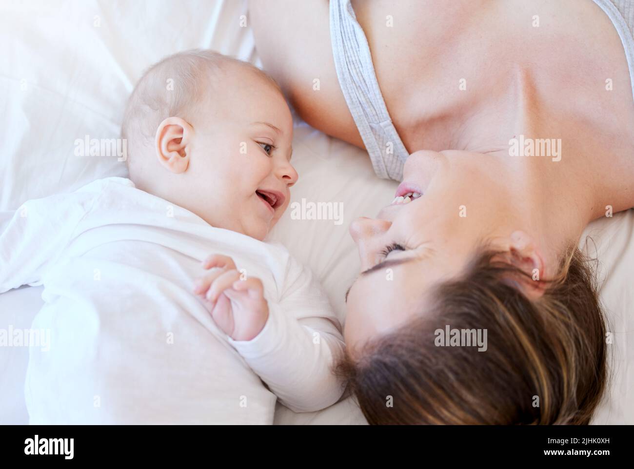Moment that I cant miss. a young mother bonding with her adorable baby boy at home. Stock Photo
