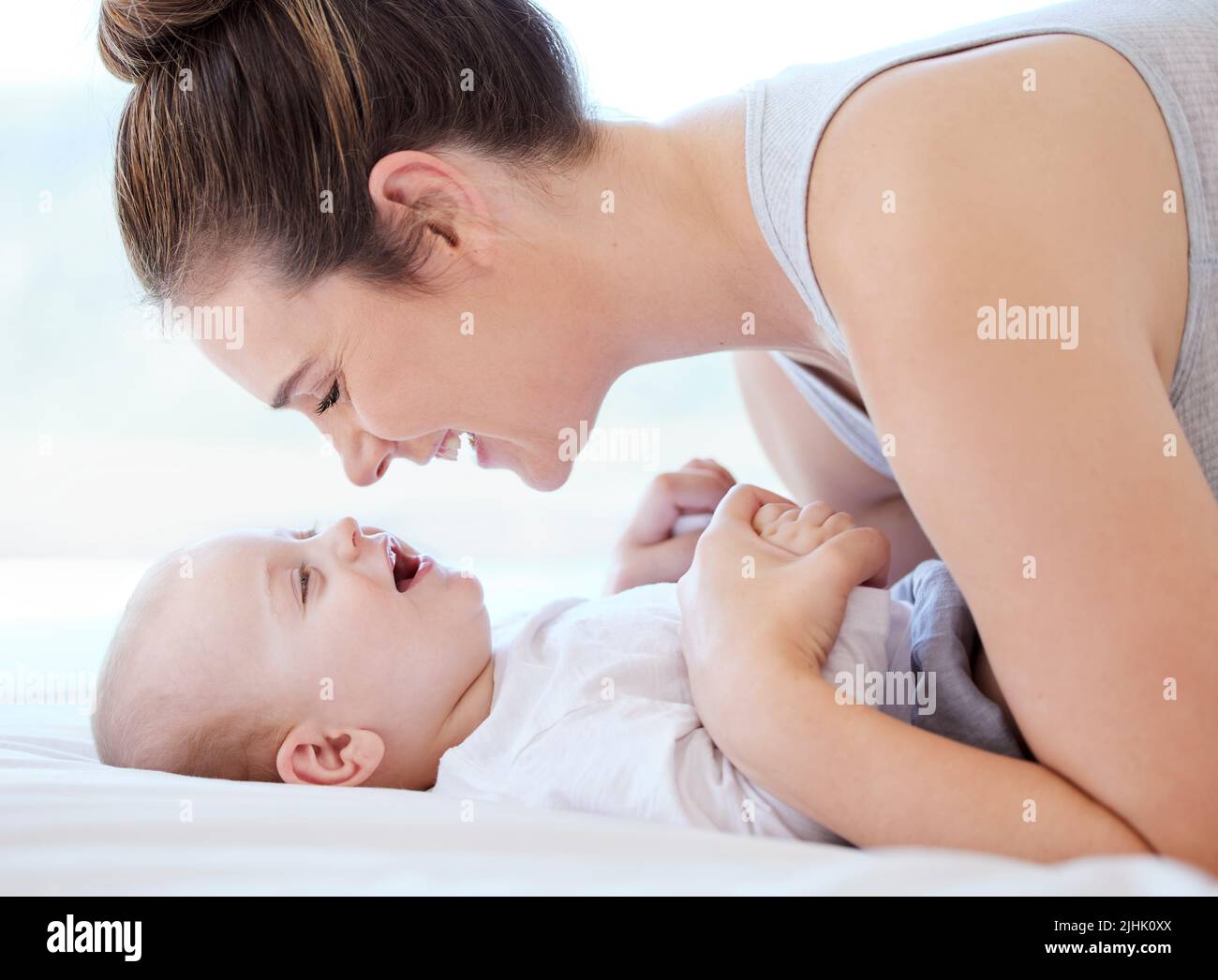 Youre the star that tells me to shine. a young mother bonding with her adorable baby boy at home. Stock Photo