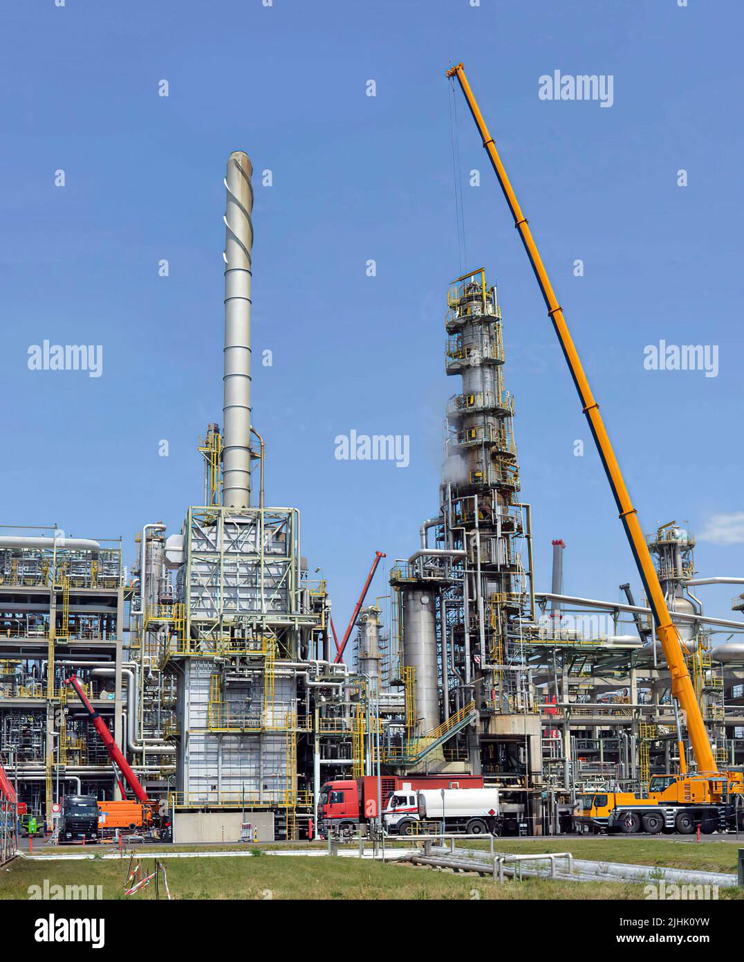 Inspection work in an oil refinery, blue sky background Stock Photo Alamy