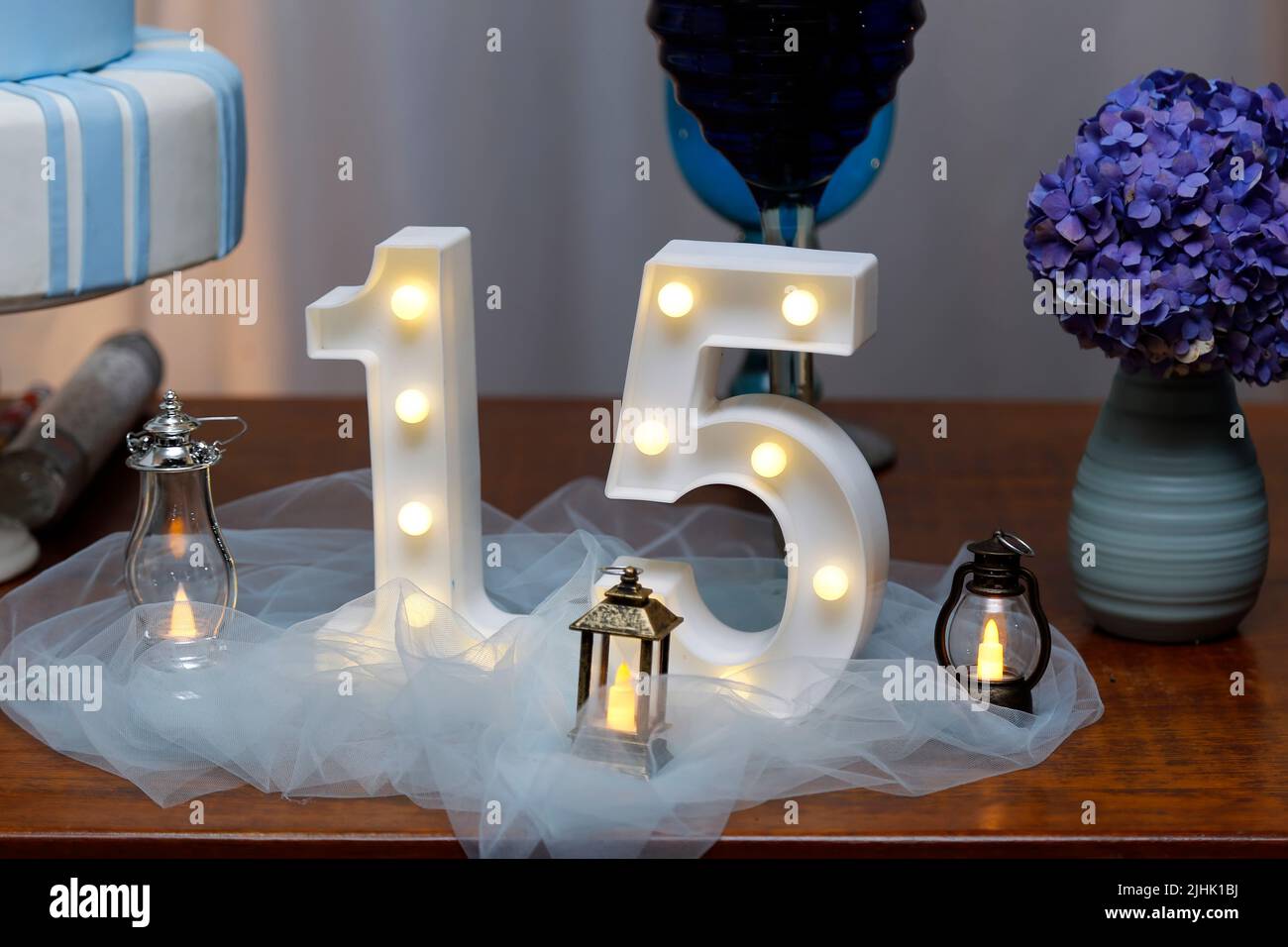 number fifteen with lights at 15th birthday party - light party Stock Photo