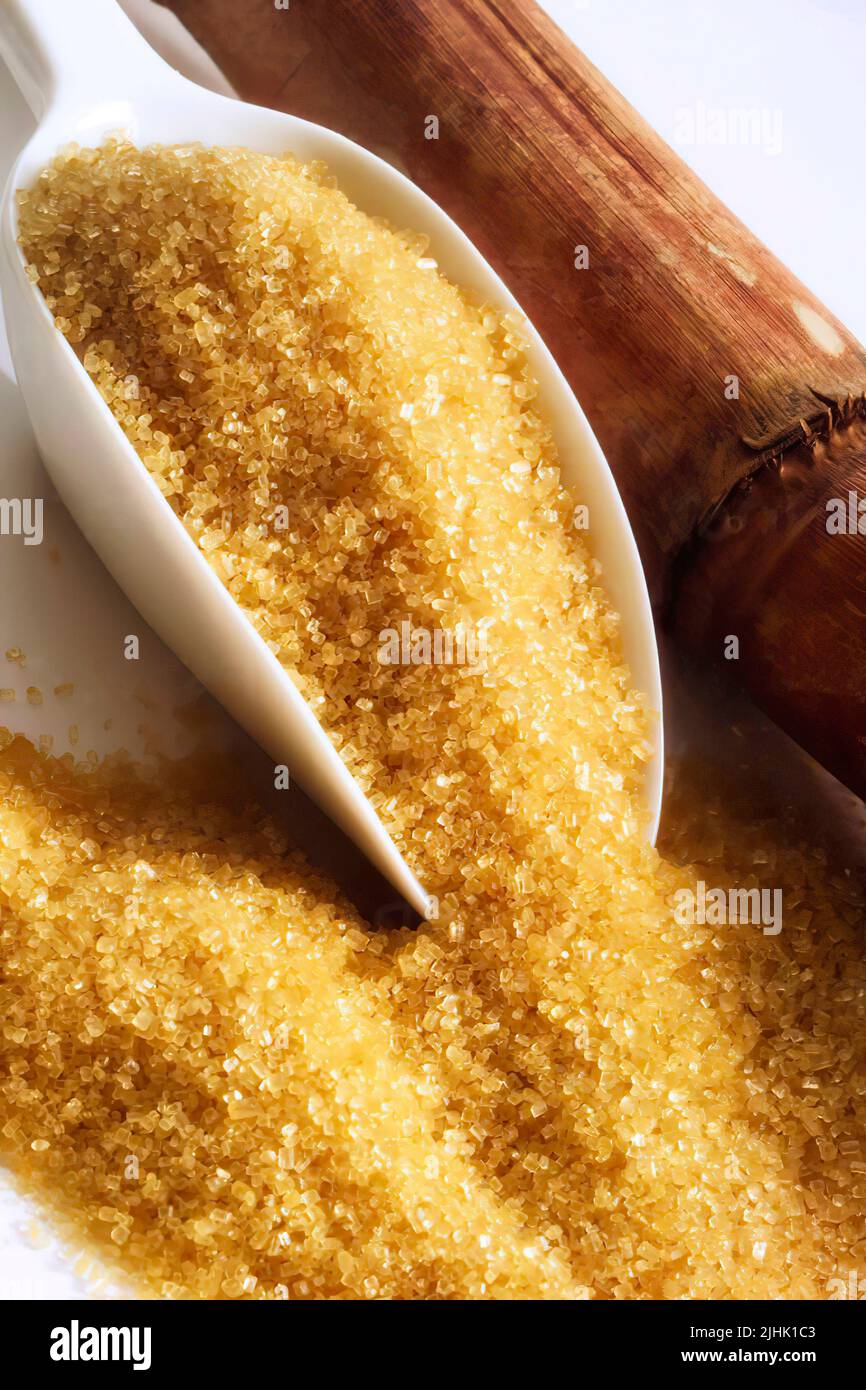 Brown sugar on shovel, close up. Vertical photo Stock Photo - Alamy