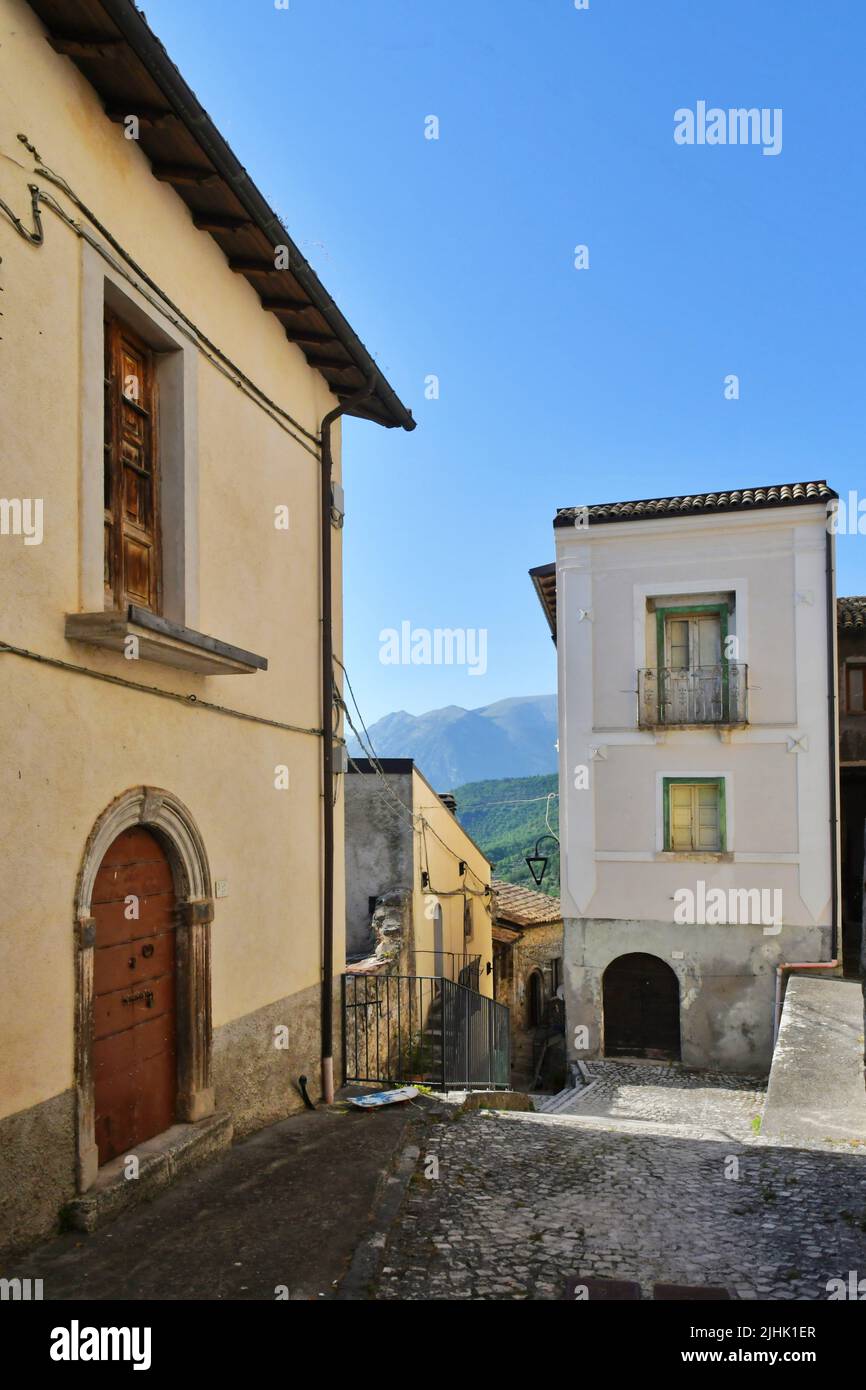 A narrow street between the old stone houses of Cansano, a medieval