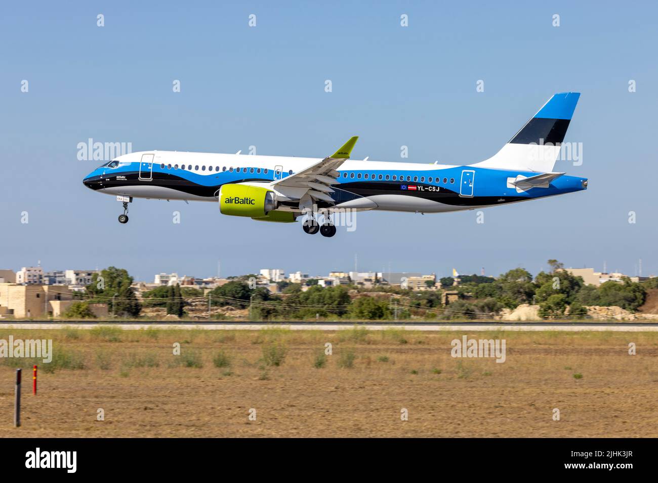 Air Baltic Airbus A220-300 (REG: YL-CSJ) in the Estonian Flag special livery, on short final for runway 31. Stock Photo