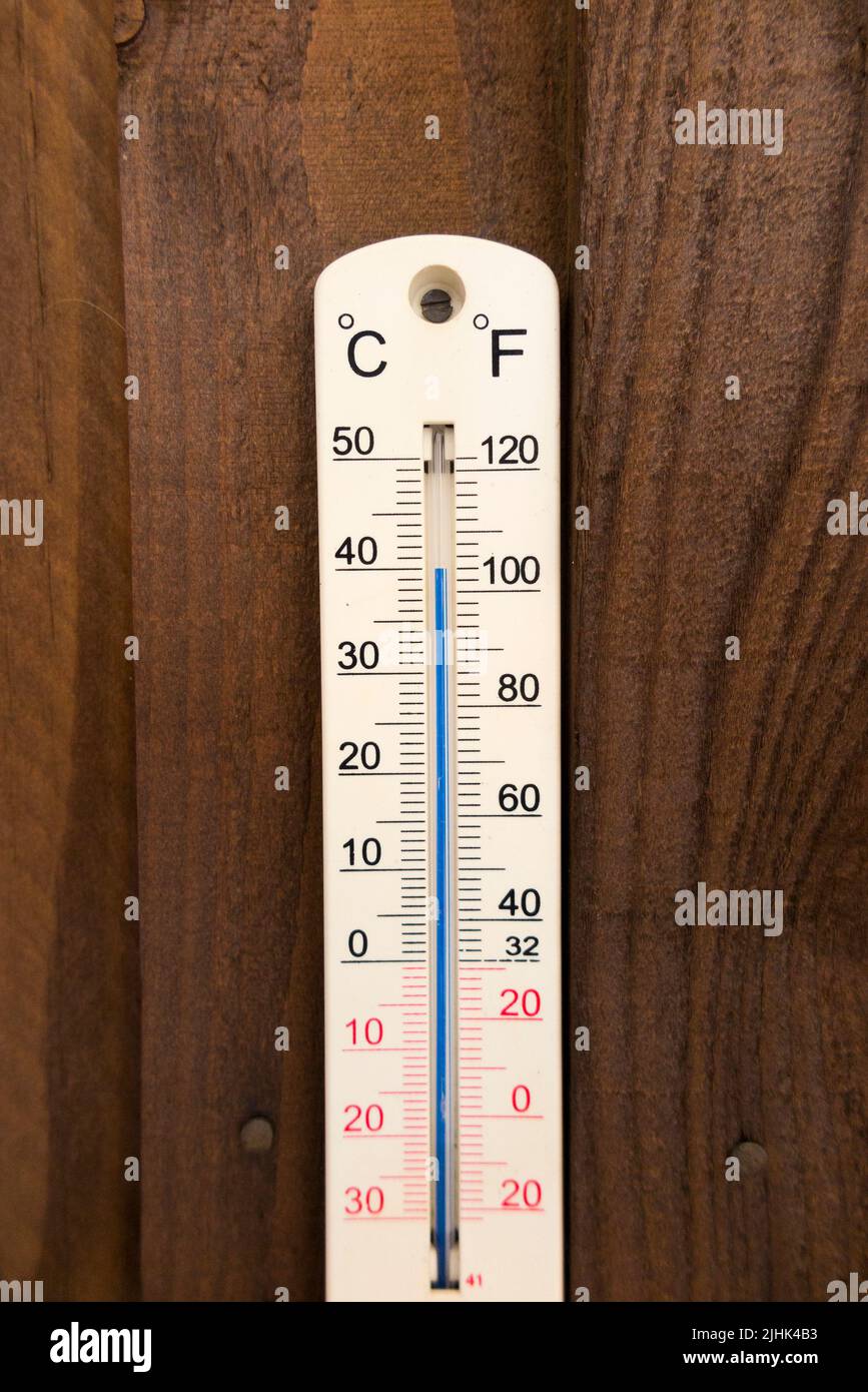 Twickenham, London, England, UK. 19th July, 2022. Garden thermometer (which is an accurate one) tops 40°C Celsius (104°F) at around about 1:00 in the afternoon. The thermometer has shade on both sides so gives accurate air temperature information. Stock Photo