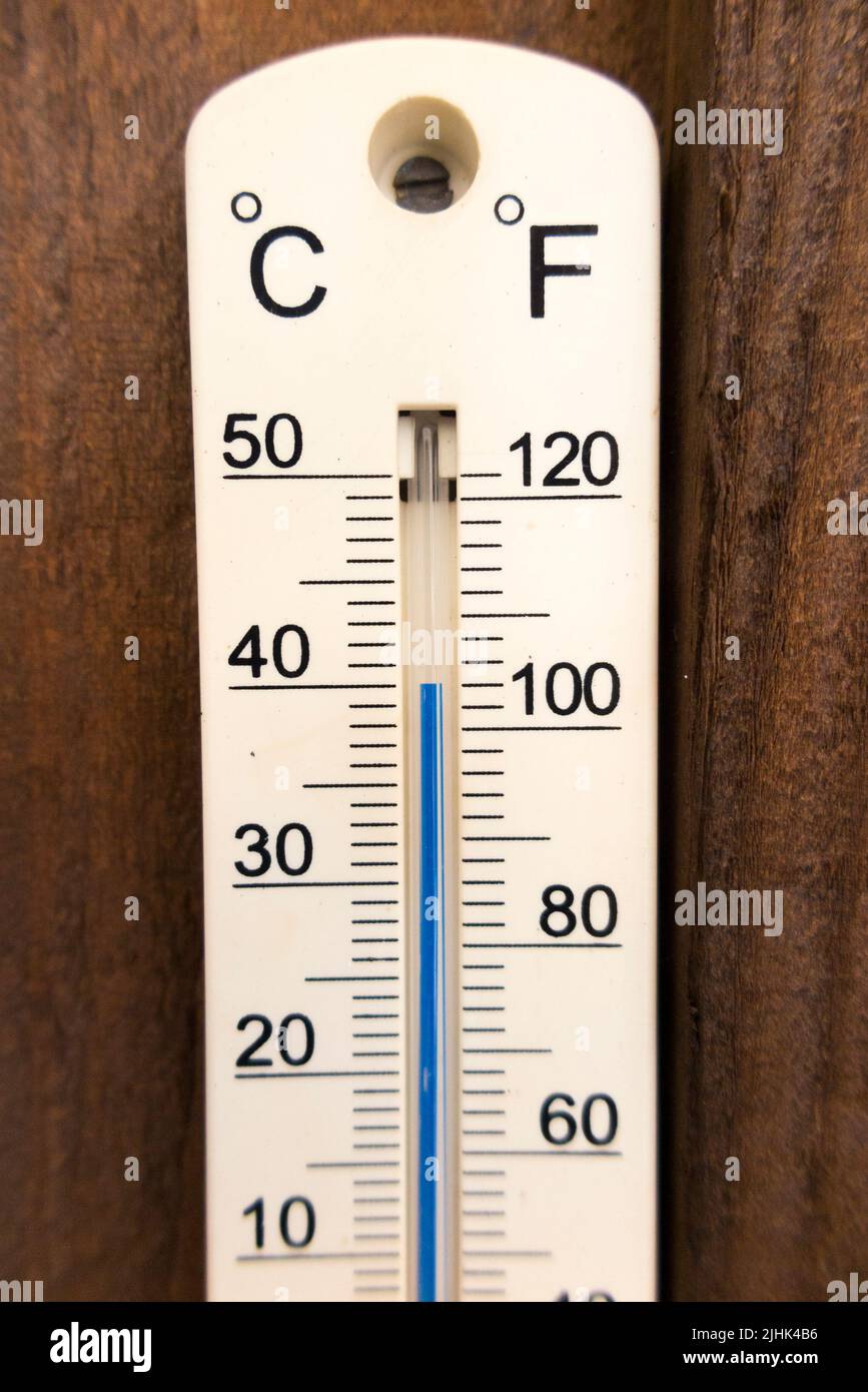 Twickenham, London, England, UK. 19th July, 2022. Garden thermometer (which is an accurate one) tops 40°C Celsius (104°F) at around about 1:00 in the afternoon. The thermometer has shade on both sides so gives accurate air temperature information. Stock Photo