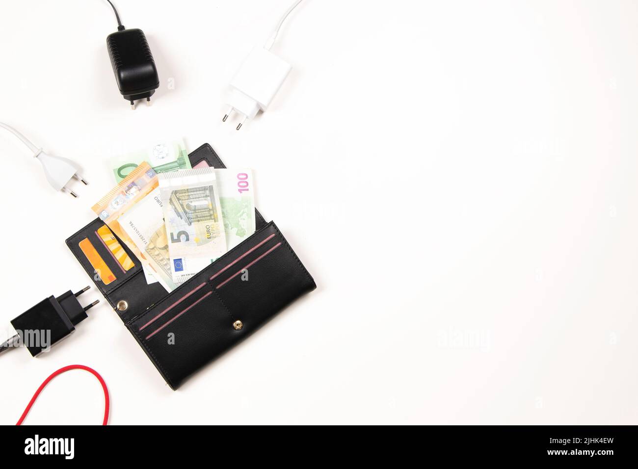 Electric power supply power cords cable plugged in open wallet with
