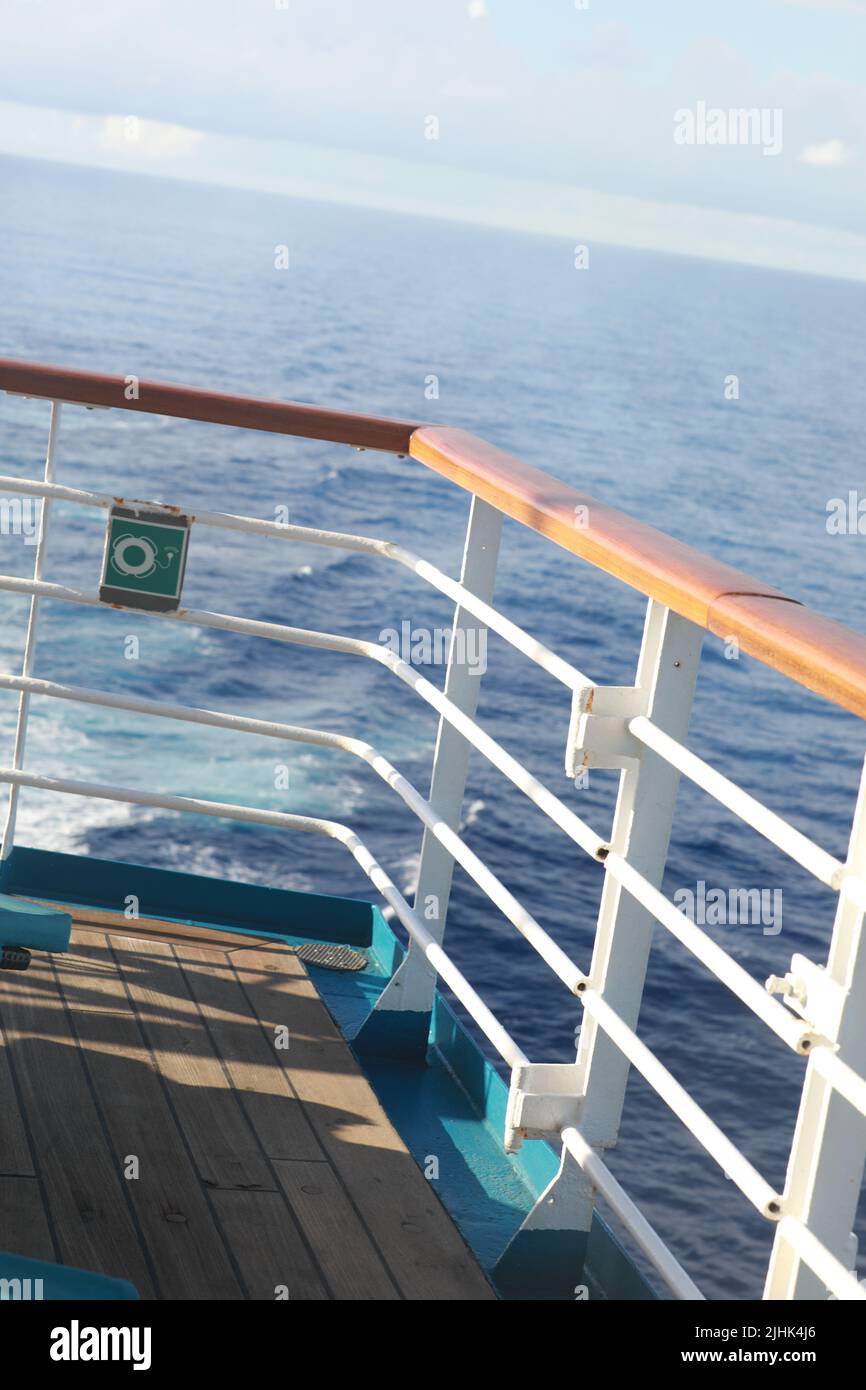 Railing of cruise ship with ocean view Stock Photo - Alamy