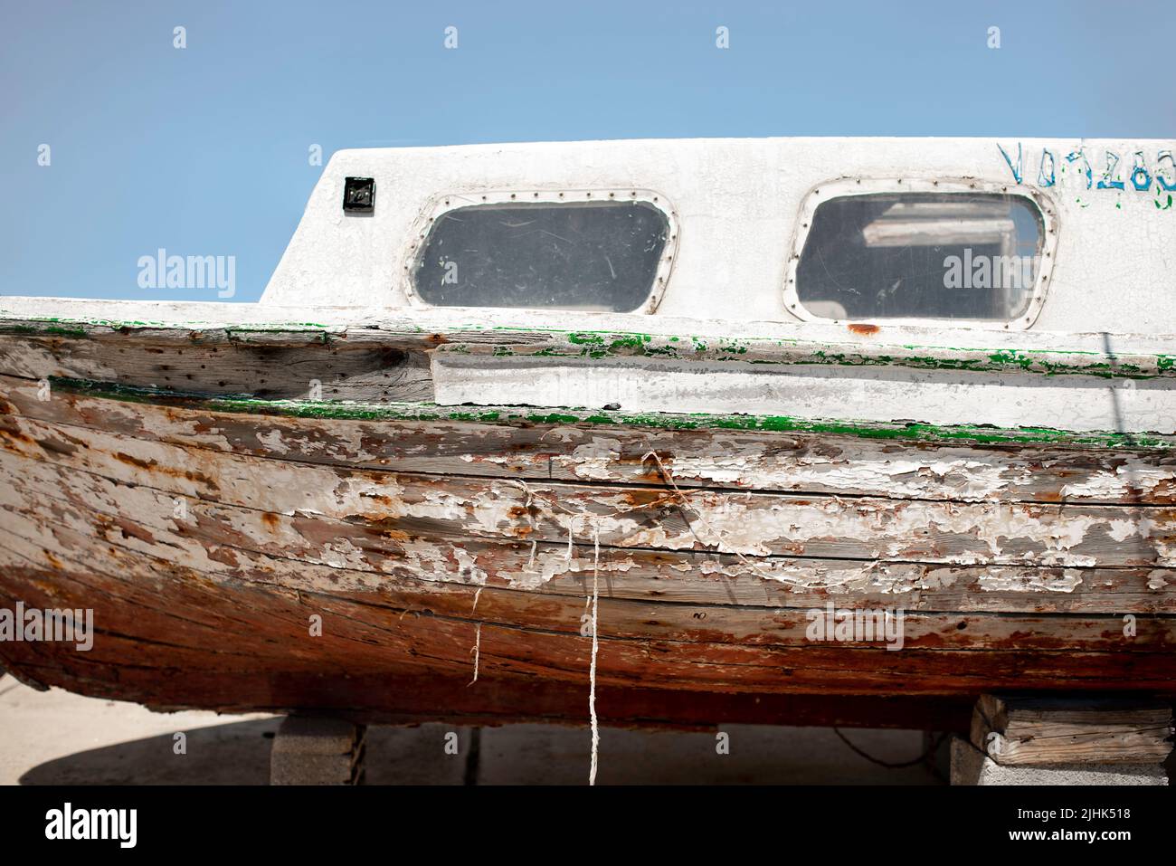 Old wooden boards vintage little boat in need for reparation. Boat