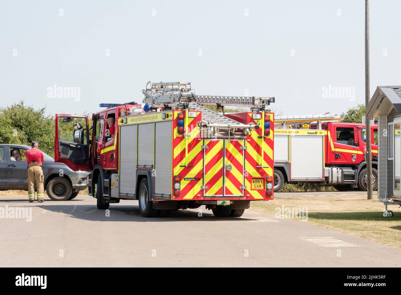 Tuesday, 19 July 2022.  Fire appliances attending a heath fire at the edge of Ken Hill marshes between Snettisham & Heacham in West Norfolk. Stock Photo